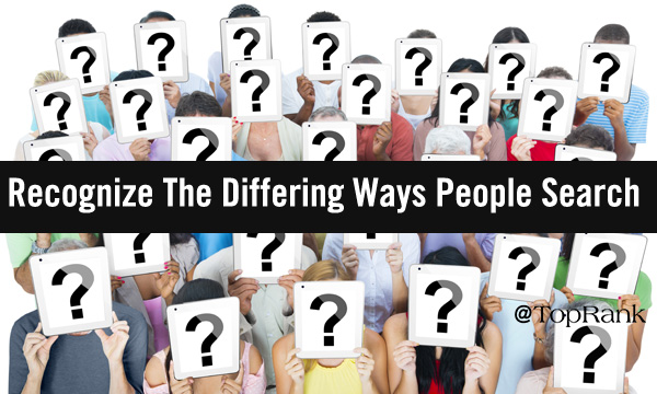 People holding up question mark signs image.