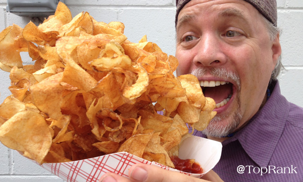 Lane R. Ellis eating spiral potatoes at the Minnesota State Fair in 2014.