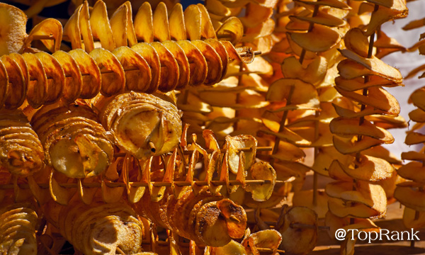 Spiral potatoes on a stick image.
